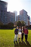 A group of young adults in an urban setting - taken into the sun with slight solar flare