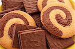 Chocolate cookie and cup of coffee on red background