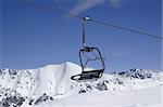 Chairlift, close-up. Ski resort Dombay. Caucasus Mountains.