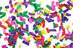 close up of confetti on white background