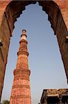 Qutab Minar  through arch, Delhi, India. Highest free standing minaret