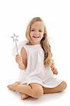 Little happy fairy or angel with magic wand sitting - isolated