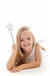 Little fairy with magic wand laying on the floor - isolated