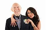 Rich elderly man with Hispanic gold-digger companion or wife