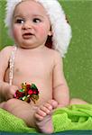 Christmas Baby playing with decorations.  FOCUS on Foot