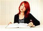 beautiful caucasian female student with book reading