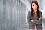 Young attractive business woman in corridor of modern building in outdoor.