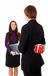 teen boy giving a gift to a girl. Isolated at white background