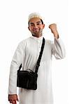 An ethnic arab or south asian man dressed in traditional cultural clothing.  He is smiling and one arm clenched in a victory fist of success