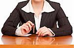 Business woman holds house key for handing over of keys. Isolated on white background.