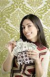 retro purse dollar woman smiling on vintage green wallpaper