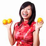 Oriental girl holding a Mandarin Tangerine