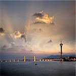 Cityscape of Macau with bridge and tower under sunset in Macao, Asia.