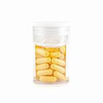 yellow pills isolated on a white background