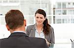 Attractive female manager during a interview with a businessman in her office