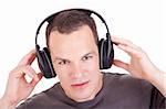 man listening music in headphones, isolated on white background, studio shot