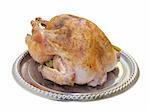 A close-up of a roasted turkey on a silver-toned platter. Clipping path.