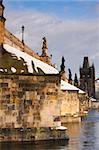 Famous Charles bridge on Vltava river in Prague in winter