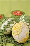 Easter eggs with beautiful yellow and green crochet decoration
