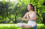 A young girl in one of the yoga postures