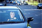 Girl in a car traveling on a busy highway