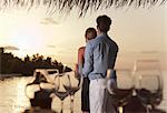 Couple standing together on dock