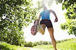 Woman running in forest