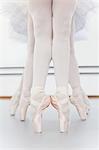 Ballet dancers' feet on pointe