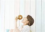 Woman eating bagel