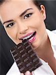 Portrait of beautiful woman, she holding chocolate bar