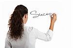 Young businesswoman drawing the word sucess, isolated on white background