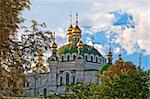 Kievo-Pecerskaya lavra (church) in summer with blue cloudy sky in background (Kiev, Ukraine)