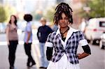 A beautiful african american woman in a city setting with friends