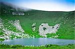 Blue mountain lake in the clouds