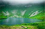 Blue mountain lake in the clouds