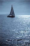 Lone yacht sailing in the Adriatic sea. Doutone image