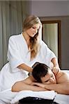 The girl does massage to the client