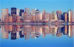 New York City Manhattan Panorama at dusk with skyscrapers and reflection