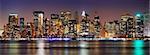 New York City night panorama with Manhattan Skyline over Hudson River with reflection.