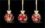 Three red Christmas spheres on a black background