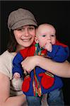 Beautiful mother and baby on a black background