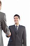 Delighted businessmen shaking their hands after a meeting at work