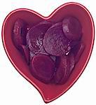 Vegetables are Part of a Heart Healthy Diet. Beets  in a Heart Shaped Bowl Isolated on White with a Clipping Path.