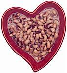 Vegetables are Part of a Heart Healthy Diet. Black Eyed Peas  in a Heart Shaped Bowl Isolated on White with a Clipping Path.