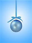 Blue christmas ball with ribbon on blue background with copy space for text