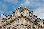 The upper floors of this apartment building was taken midday in Paris, France.