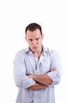 handsome man upset with his arms crossed, isolated on white background. Studio shot.