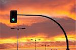 Traffic lights on the road at sunset