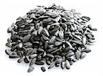 Small pile of sunflower seeds isolated on white background.