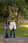 A couple happy and walking in a park